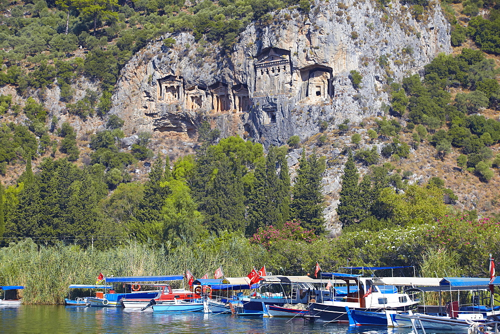 Lycian tombs of Dalyan with fishing and tourists boats below, Dalyan, Anatolia, Turkey, Asia Minor, Eurasia