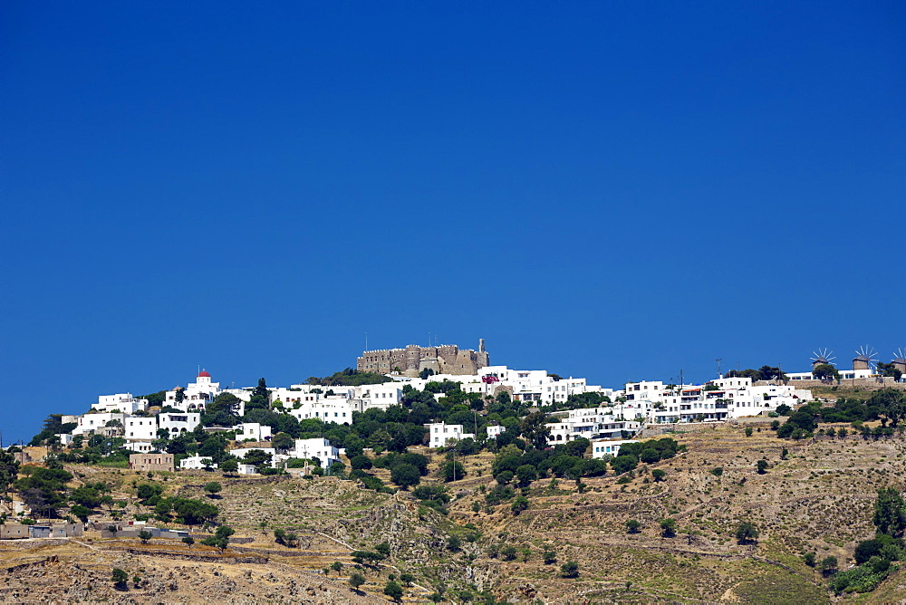 View of Chora town and Monastery of St. John the Evangelist, UNESCO World Heritage Site, Patmos Island, Greek Islands, Greece, Europe