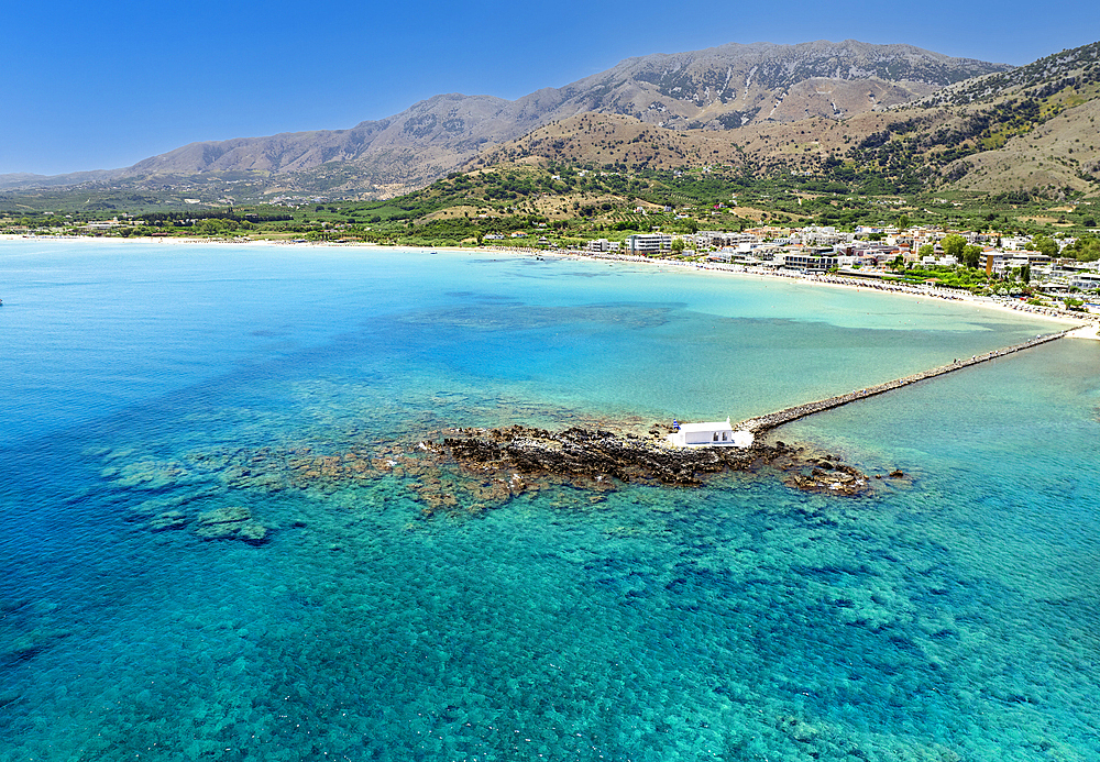 Aerial drone photo of Georgioupoli and famous chapel of Agios Nikolaos built at sea with a small path connecting to mainland, Chania, Crete island, Greek Islands, Gteece, Europe