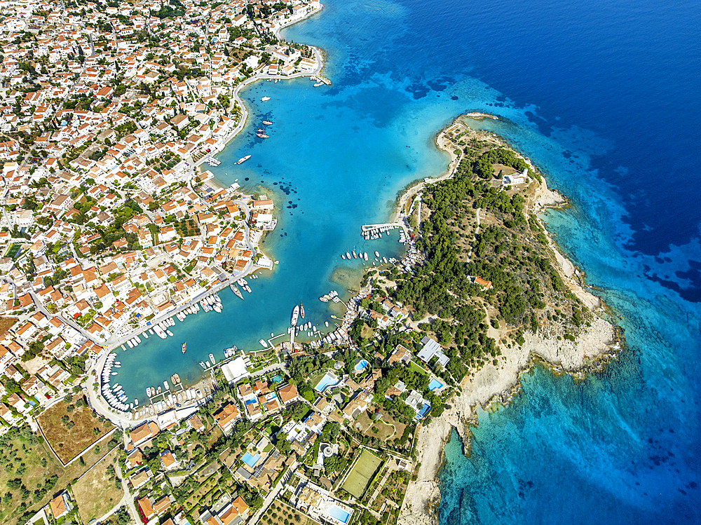 Aerial drone photo of picturesque old town and harbor of Spetses island with emerald crystal clear sea, Saronic gulf, Greece