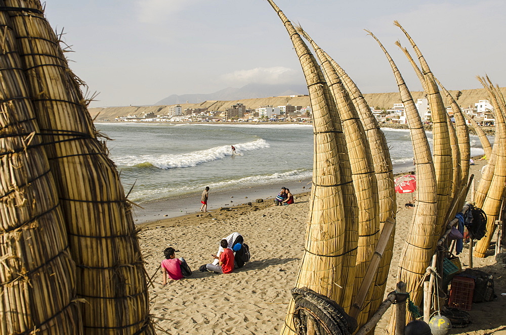 Caballitos de totora or reed boats on the beach in Huanchaco, Peru, South America