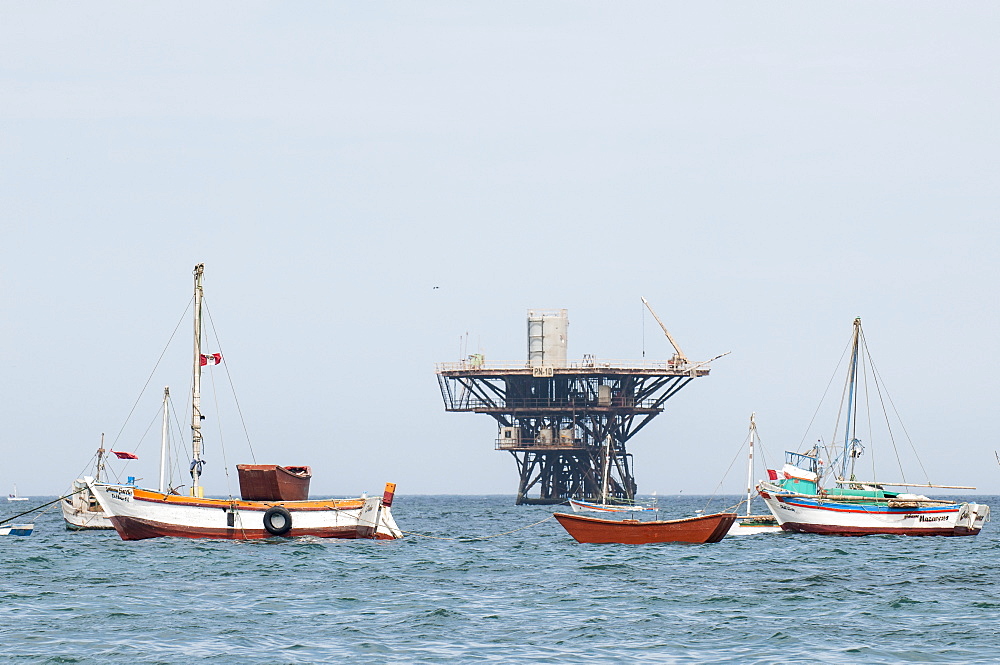 Fishing boats and oil platform off Cabo Blanco, Peru, South America