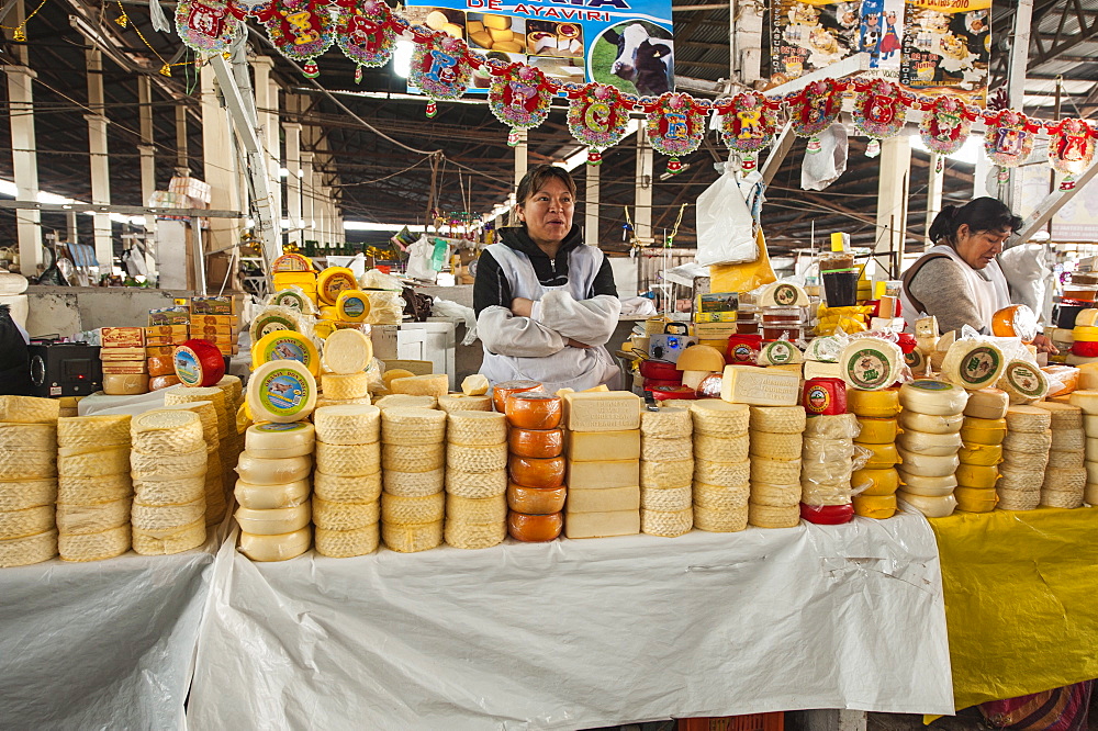 Cheese vendor in local market, Cuzco, Peru, South America