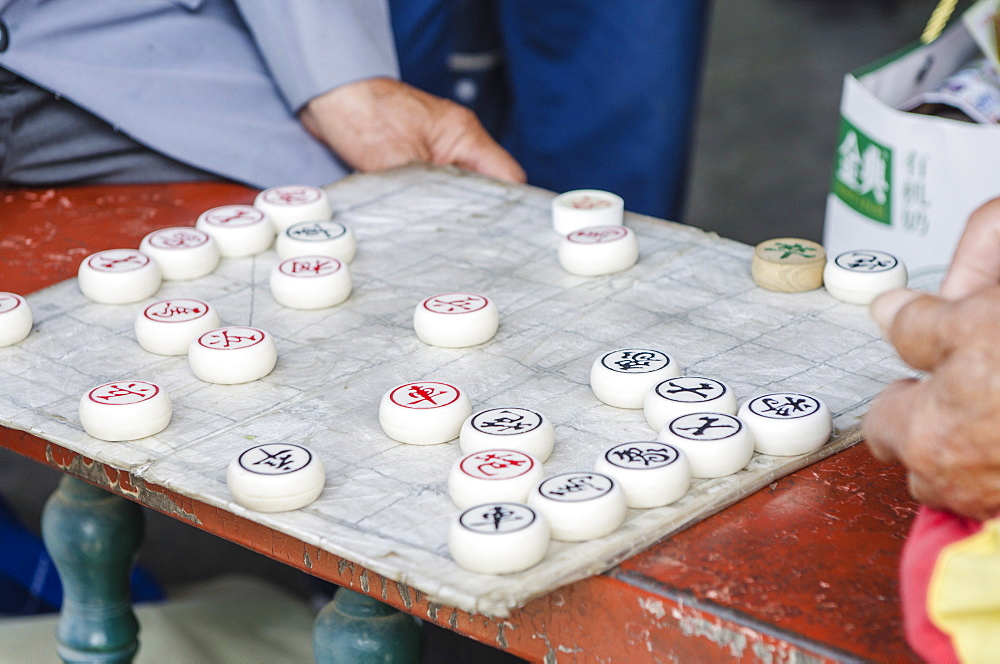 Playing xiangqi (Chinese chess) at the Temple of Heaven (Altar of Heaven), Beijing, China, Asia