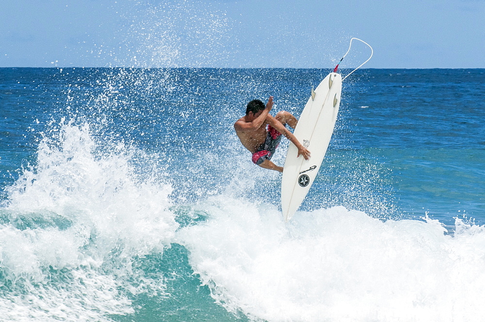 Surfing at Sunset Beach, North Shore, Oahu, Hawaii, United States of America, Pacific