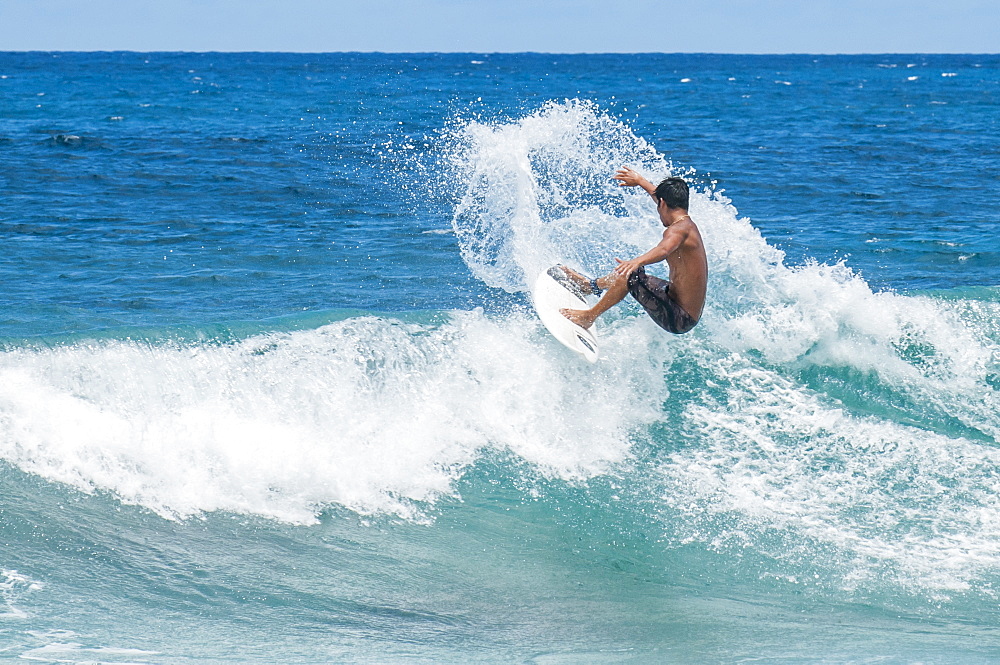 Surfing at Sunset Beach, North Shore, Oahu, Hawaii, United States of America, Pacific