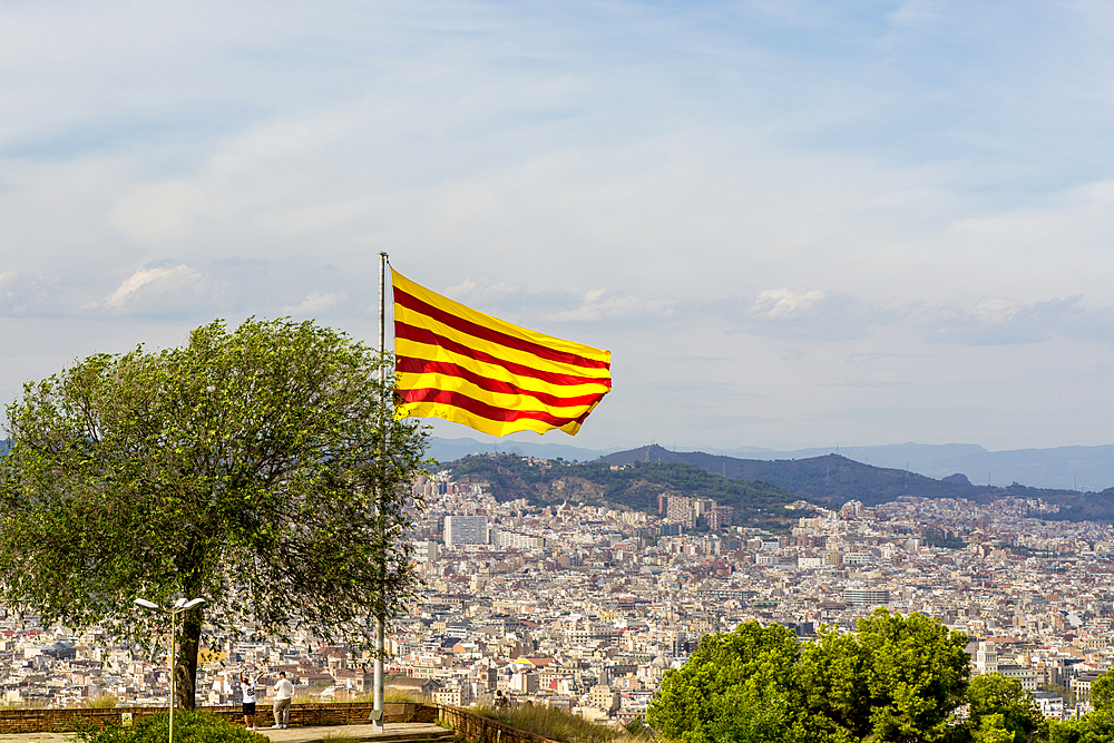 Catalan flag flies over the Montjuic Castle old military fortress on Montjuic Mountain overlooking the city, Barcelona, Catalonia, Spain, Europe