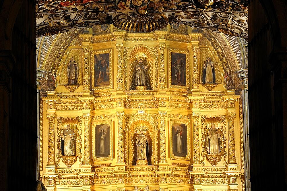 Mexico, Oaxaca, Church of Santo Domingo Interior with carved and gilded altarpiece with paintings and painted sculpted figures.