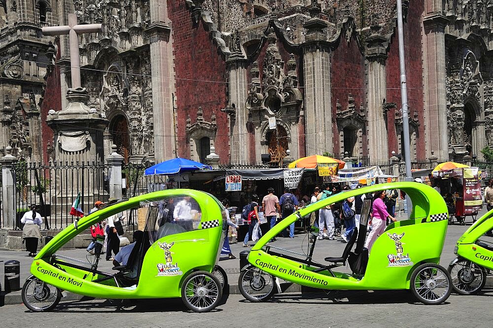 Mexico,  Federal District, Mexico City, Pedi taxis outside the Cathedral in the Zocalo.