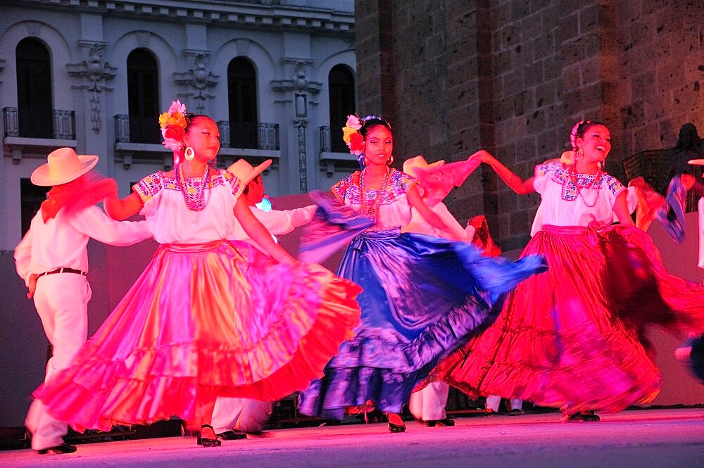 Mexico, Jalisco, Guadalajara, Plaza Tapatia Folk dancers from Oaxaca State perform at carnival.