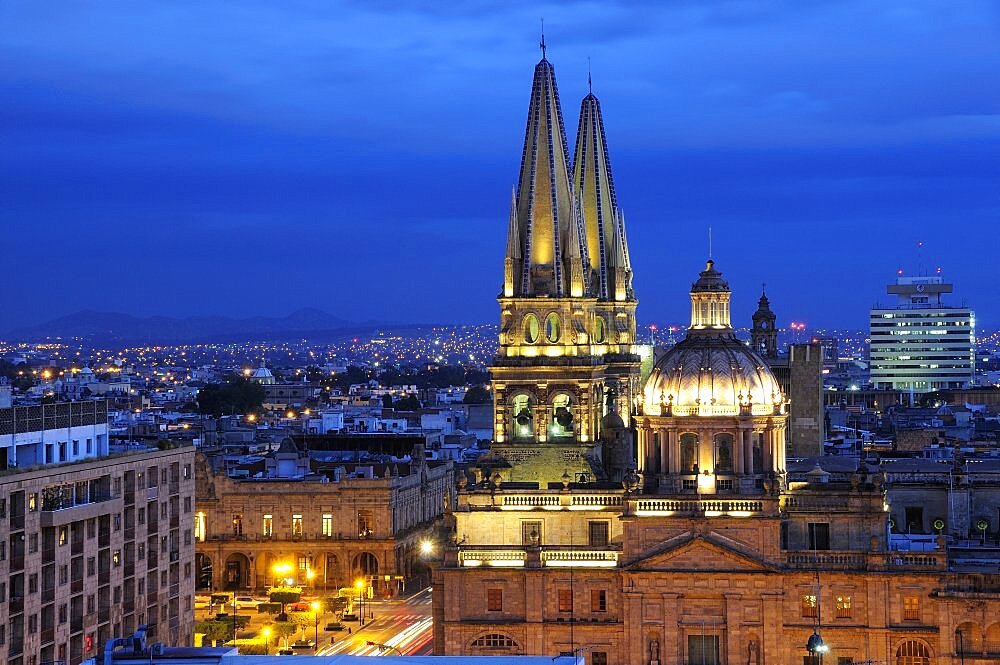 Mexico, Jalisco, Guadalajara, View of Cathedral and city at night.