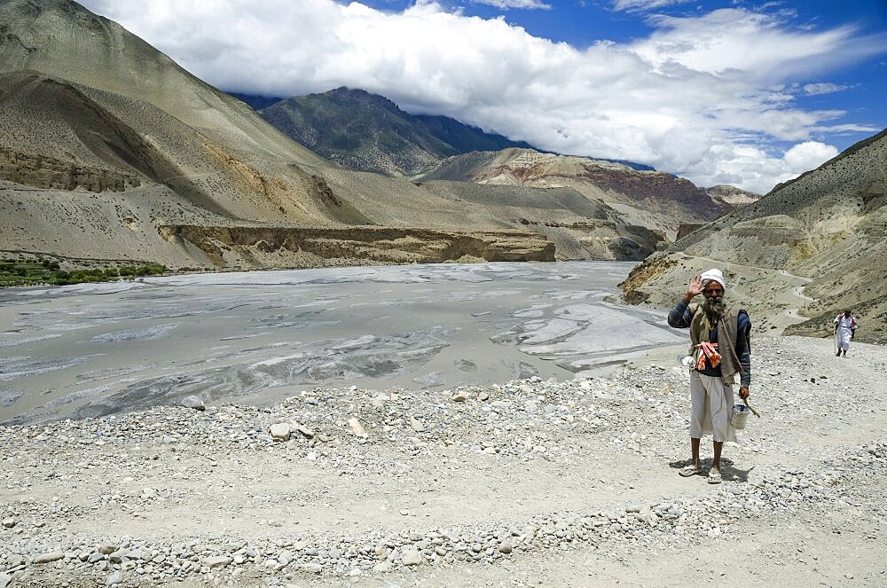 Nepal, Upper Mustang, Kali Gandaki gorge, Man returning from worship.