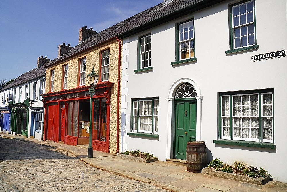 Ireland, County Tyrone, Omagh, Ulster American Folk Park 19th century street with Victorian shopfronts.