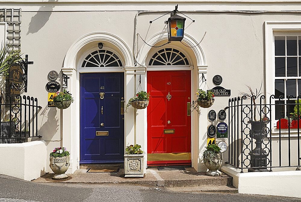 Ireland, County Cork, Kinsale, colourful doorways of terraced houses.