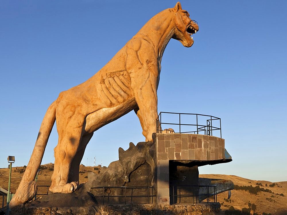 Peru, Puno, Stone statue of a Puma overlooking the city and Lake Titicaca.