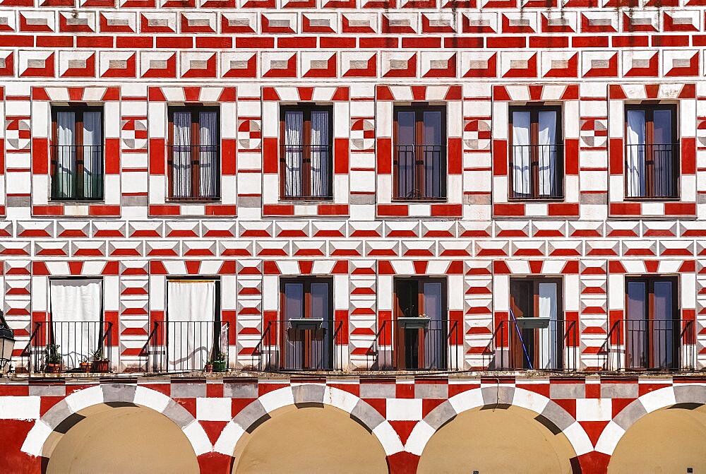 Spain, Extremadura, Badajoz, Colourfully painted exterior walls of building in Plaza Alta.