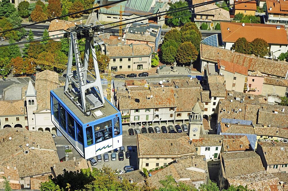 Republic of San Marino, San Marino City, Aerial Cable Car ride over city rooftops during the ascent to Monte Titano.