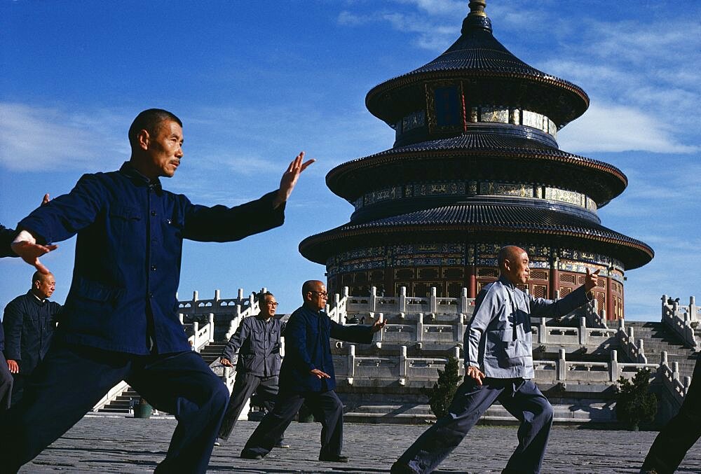 CHINA Hebei Beijing Group of men practising Tai Chi in front of the Temple of Heaven.   Peking