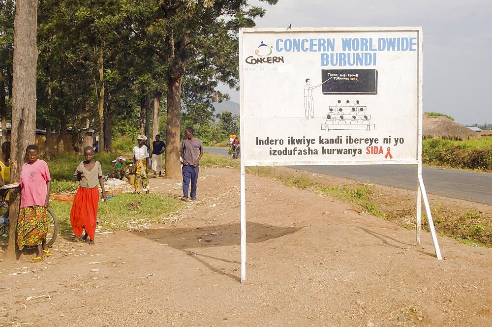 Burundi, Cibitoke Province, Buganda, Ndava Village Sign board beside the main road in Buganda Commune with HIV AIDS SIDA message.