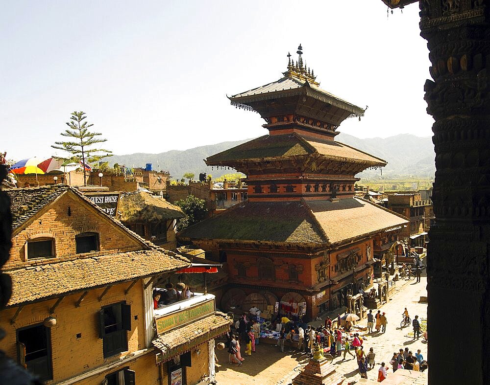 Nepal, Bhaktapur, Taumadhi Square View through pillars of temple of goddess Siddhi Laxmi.