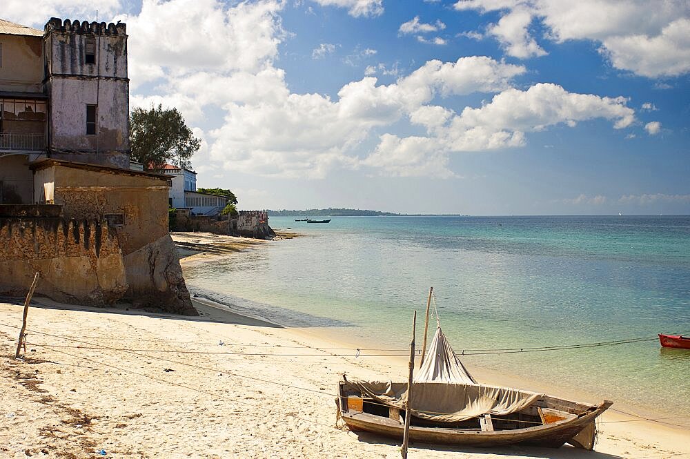 Tanzania, Zanzibar, Stone Town, Looking along the golden sands of the beach.