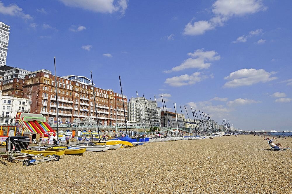 England, East Sussex, Brighton, View along the beach to Pier.