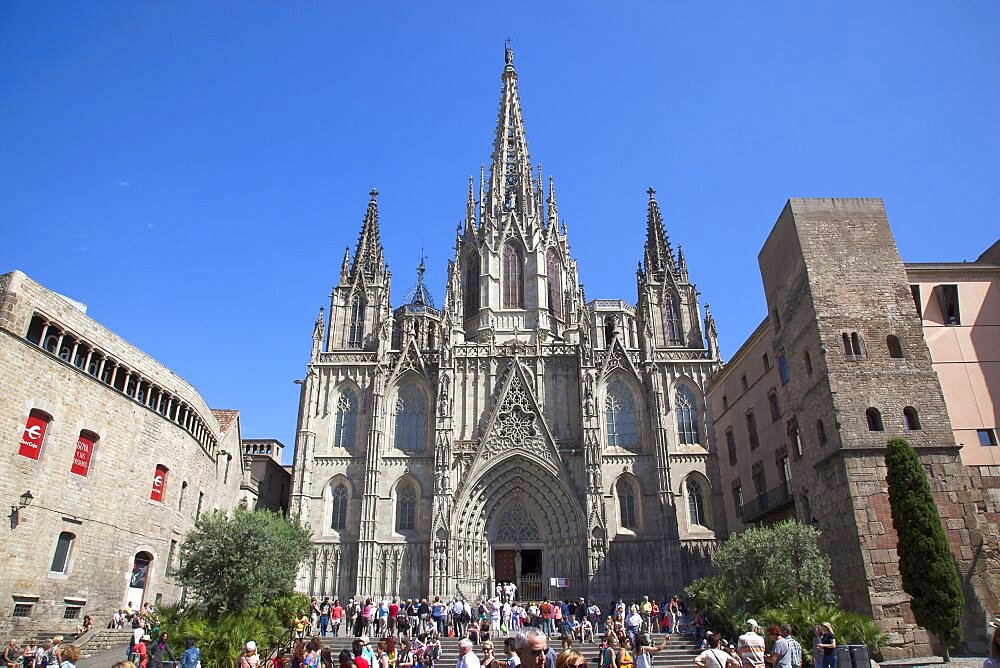 Spain, Catalonia, Barcelona, Tourists outside the Cathedral of the Holy Cross and Saint Eulalia.,