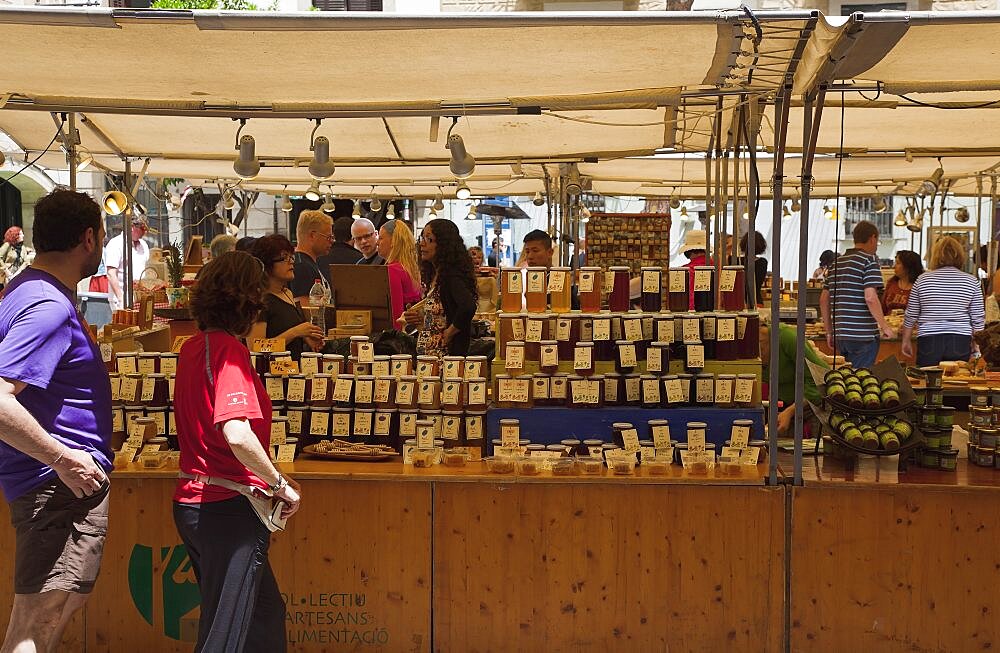 Spain, Catalonia, Barcelona, Art and farmers market in Placa del Pi next to Santa Maria del Pi church.