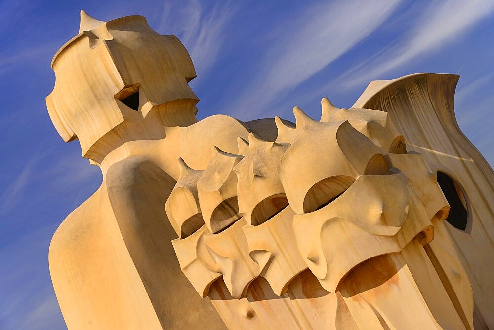 Spain, Catalunya, Barcelona, Antoni Gaudi's La Pedrera building, a section of chimney pots on the roof terrace.