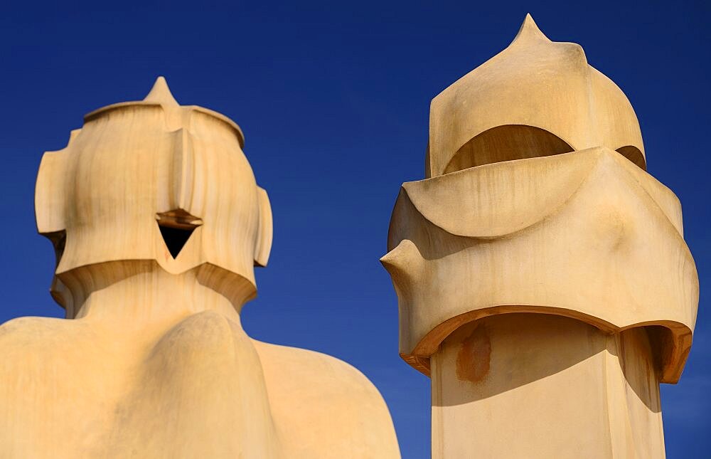 Spain, Catalunya, Barcelona, Antoni Gaudi's La Pedrera building, a section of chimney pots on the roof terrace.