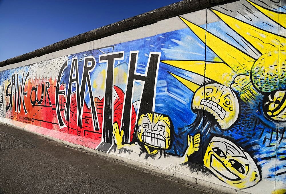 Germany, Berlin, The East Side Gallery, a 1.3 km long section of the Berlin Wall, Mural known as 'Save our Earth' by Artist Indiano.