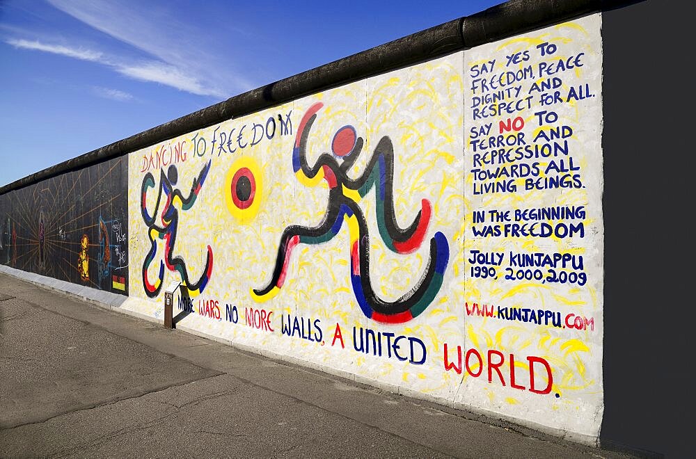 Germany, Berlin, The East Side Gallery, a 1.3 km long section of the Berlin Wall, Mural by Jolly Kunjappu called 'Dancing to Freedom'.