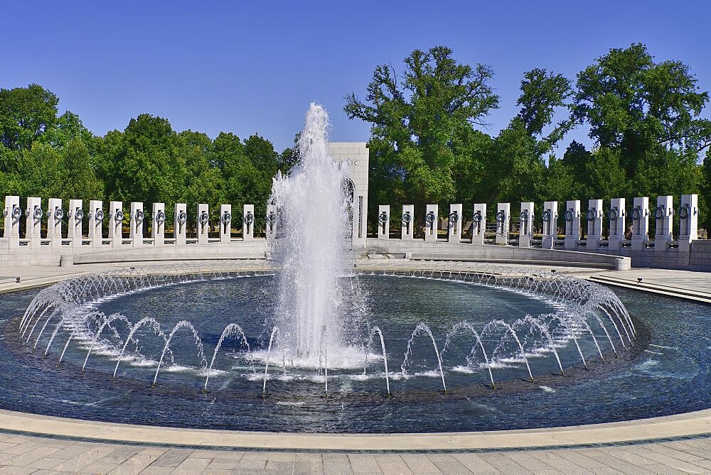 USA, Washington DC, National Mall, National World War 2 Memorial, Plaza with fountains and granite pillars.