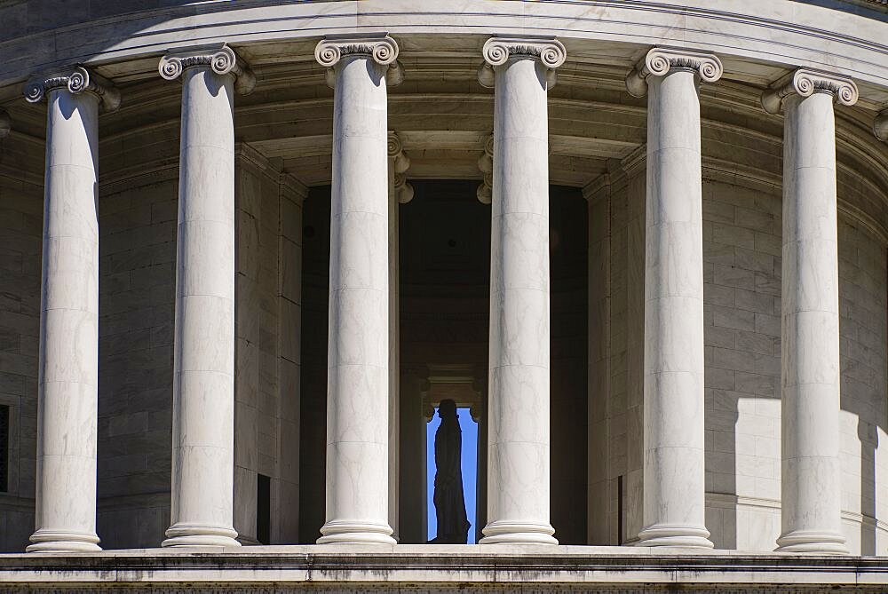 USA, Washington DC, National Mall, Thomas Jefferson Memorial, Close up view from west side with staue of Jefferson visible through the building's Ionic columns.