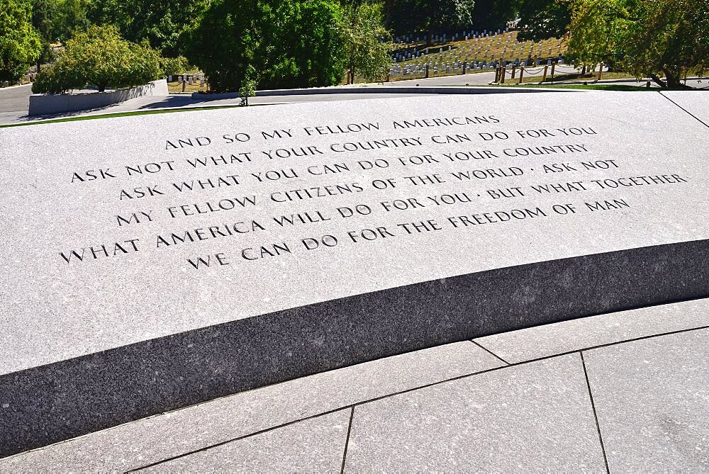 USA, Washington DC, Arlington National Cemetery, Grave of President JF Kennedy with famous quotation on wall.