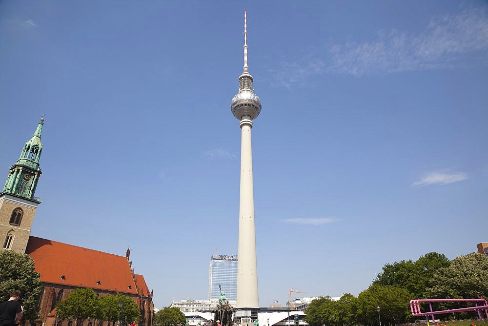 Germany, Berlin, Mitte, Fernsehturm TV Tower seen from St Marienkirche and Neptunbrunnen in Alexanderplatz.