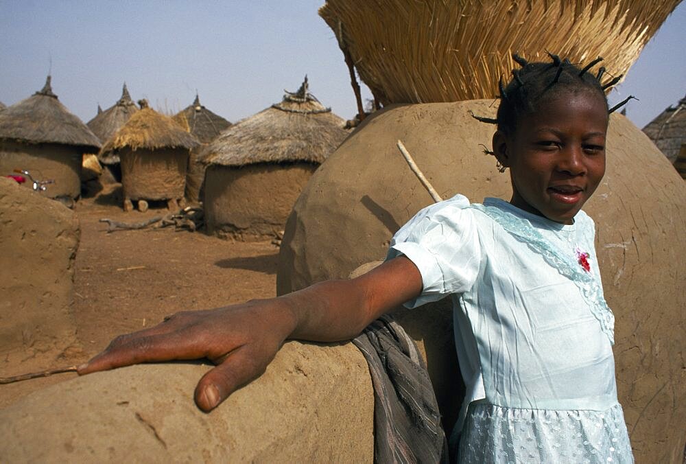 BURKINA FASO Bisaland Sigue Voisin Village Young girl in village near Garango.