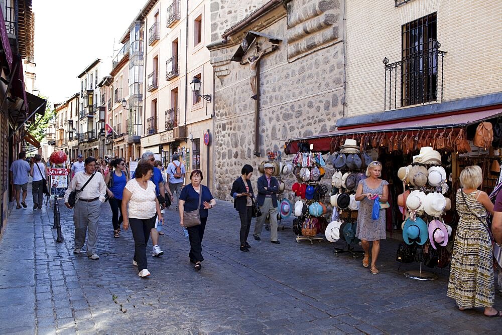 Spain, Castilla La Mancha, Toldeo, Calle Santo Tome with tourists and souvenir shops.