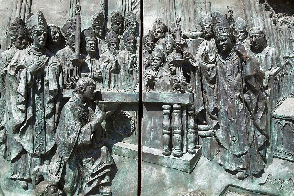 Spain, Madrid, Detail of the carving on the main door to the Cathedral de la Almudena featuring Pope John Paul II.