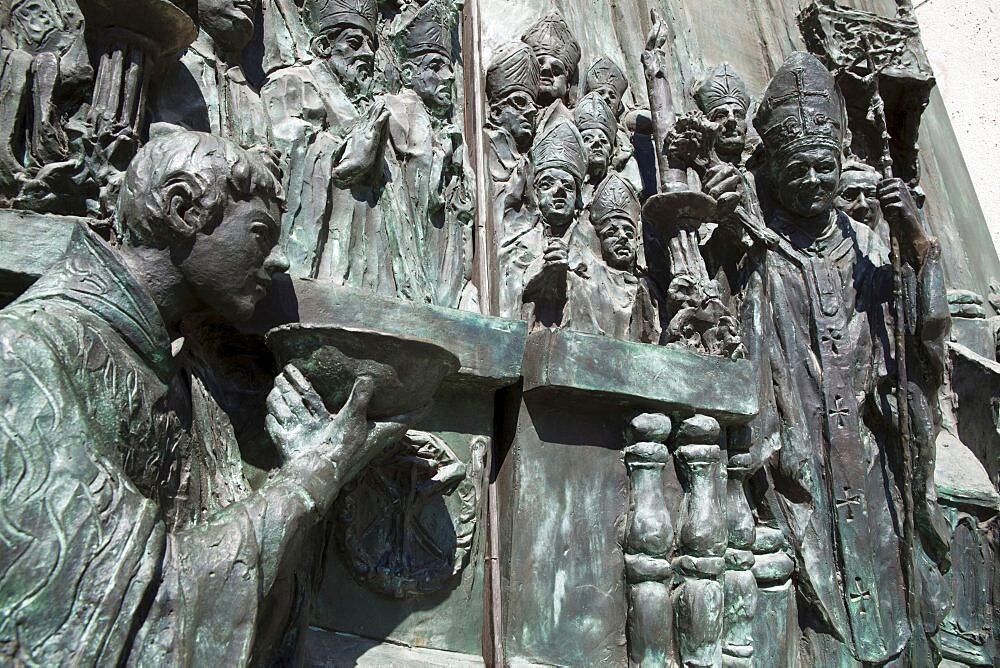 Spain, Madrid, Detail of the carving on the main door to the Cathedral de la Almudena featuring Pope John Paul II.