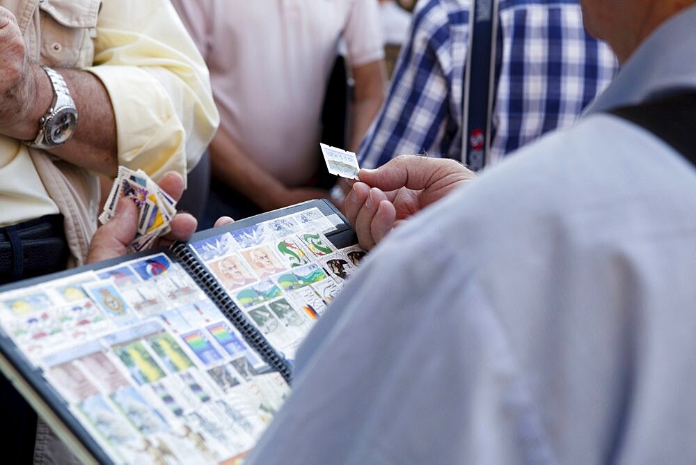 Spain, Madrid, Stamp collectors in the Plaza Mayor.