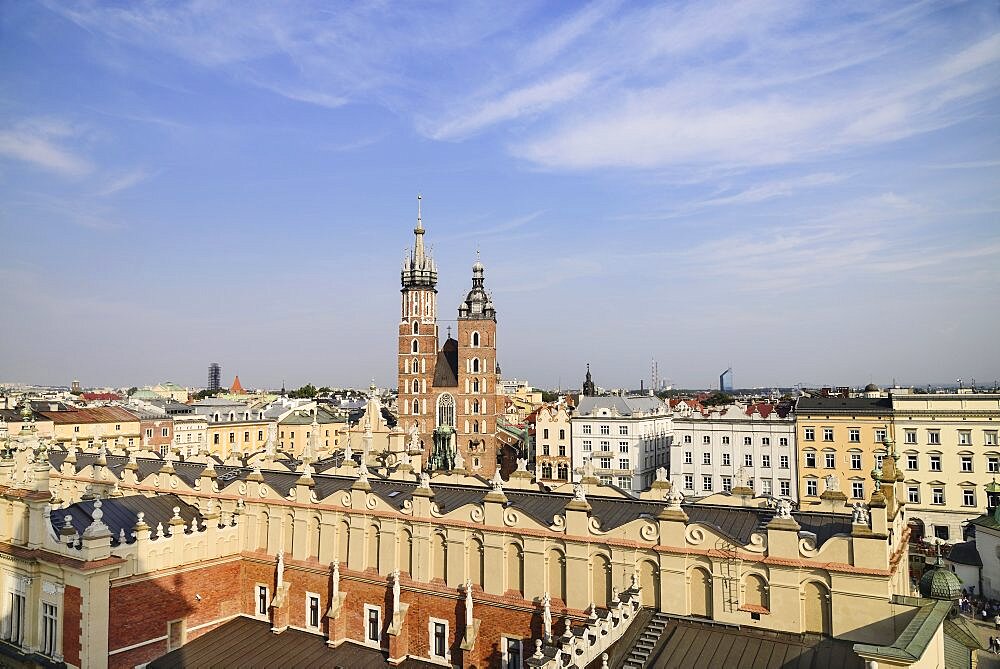 Poland, Krakow, Rynek Glowny or Main Market Square, View from the Town Hall Tower Observation deck over the Sukiennice or Cloth Hall to St Marys Church.