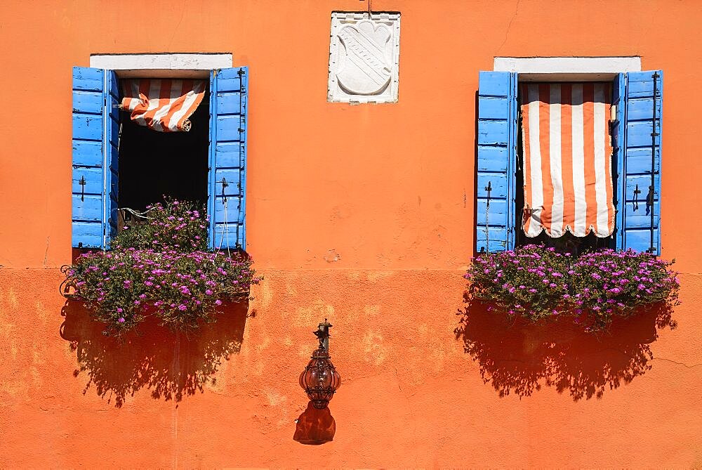 Italy, Veneto, Burano Island, Colourful row of house facades.