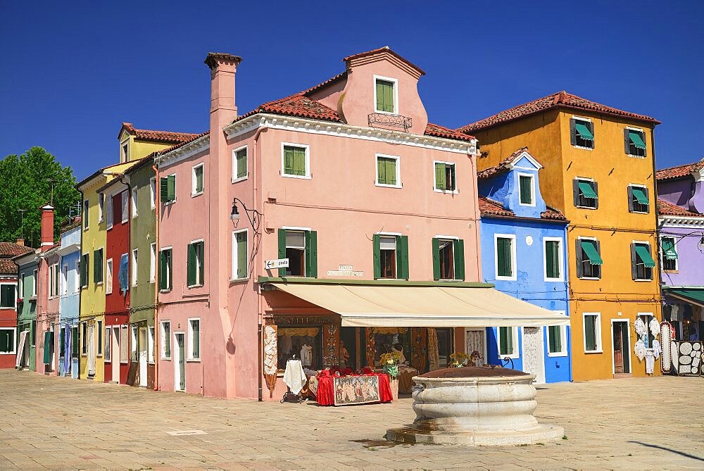 Italy, Veneto, Burano Island, Colourful row of house facades.