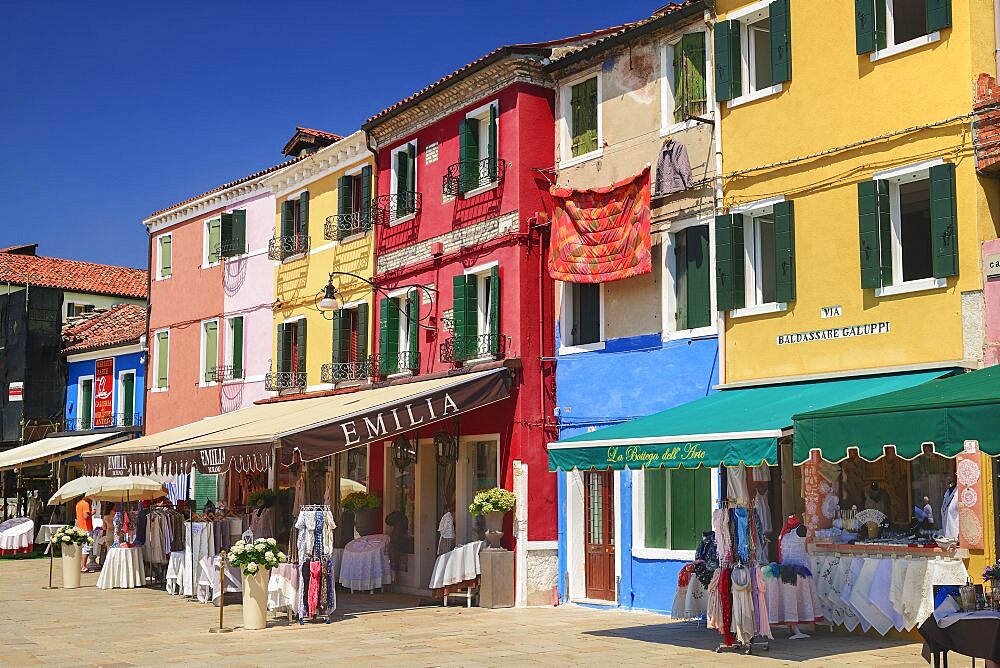 Italy, Veneto, Burano Island, Colourful row of house facades.