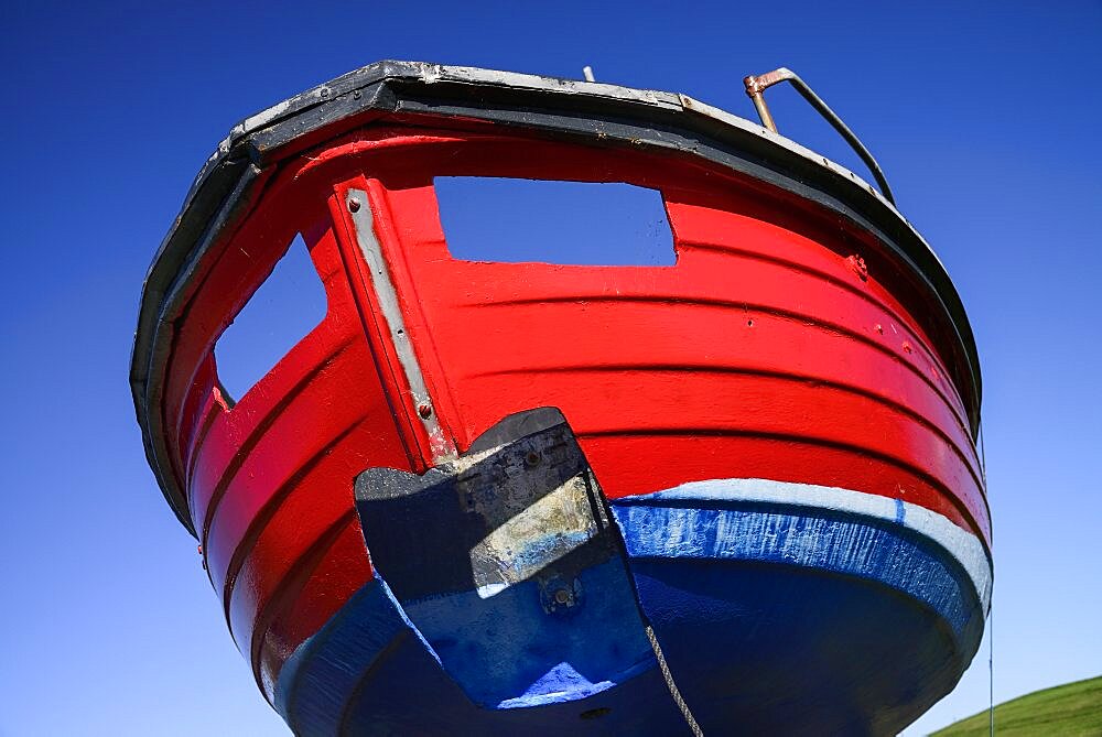 Ireland, County Sligo, Rosses Point, Colourful boat on the shore.