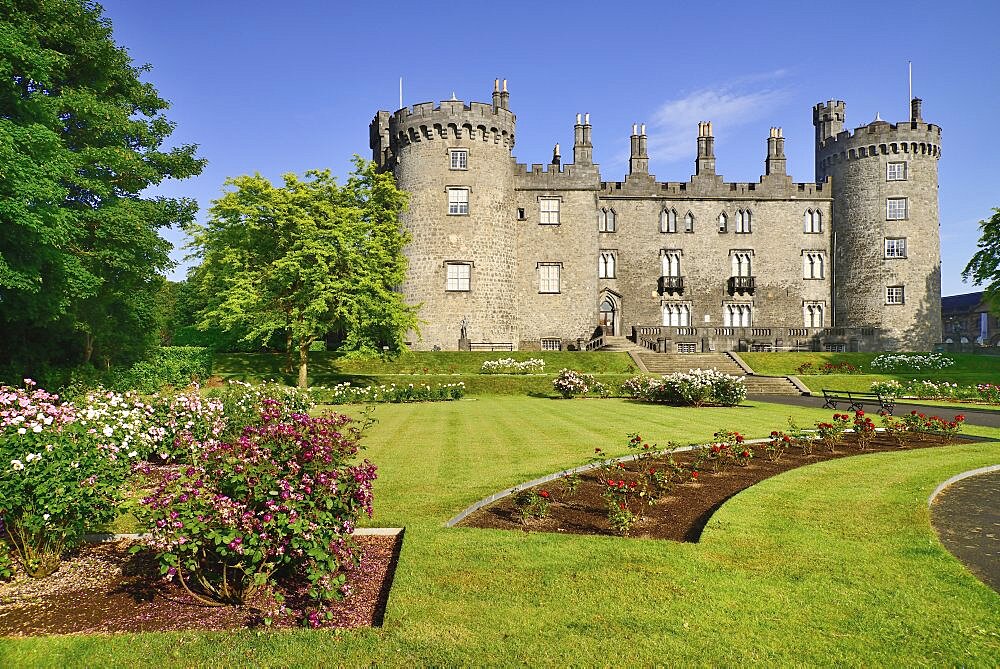 Ireland, County Kilkenny, Kilkenny, Kilkenny Castle with the Rose Garden in the foreground.