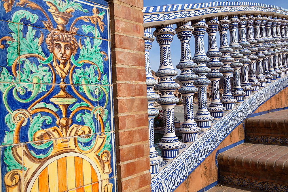 Spain, Andalucia, Seville, Detail of the ceramic balustrade on a bridge over the moat at the Plaza de Espana.