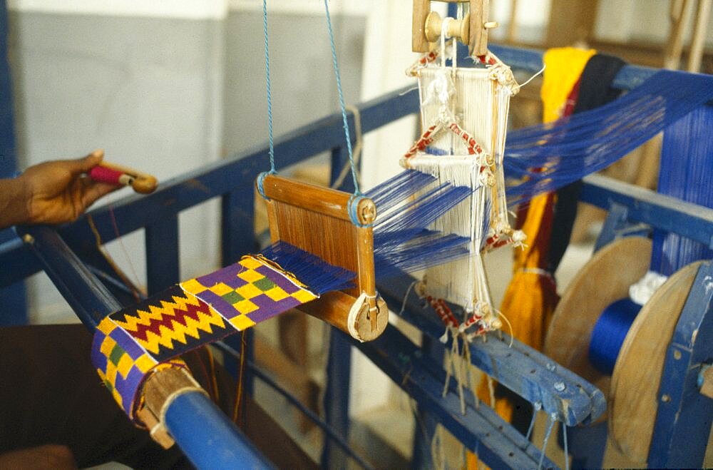 GHANA  Kumasi Weaving contemporary kente cloth designs.
