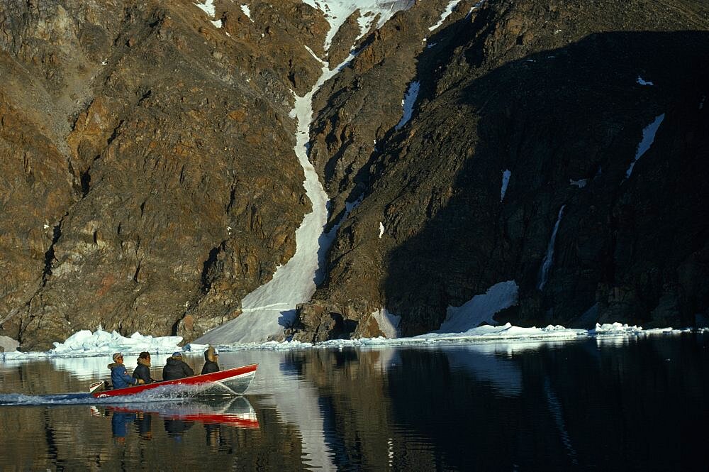 CANADA Nunavut Baffin Island Four Inuit men is boat for a fishing trip Eskimo